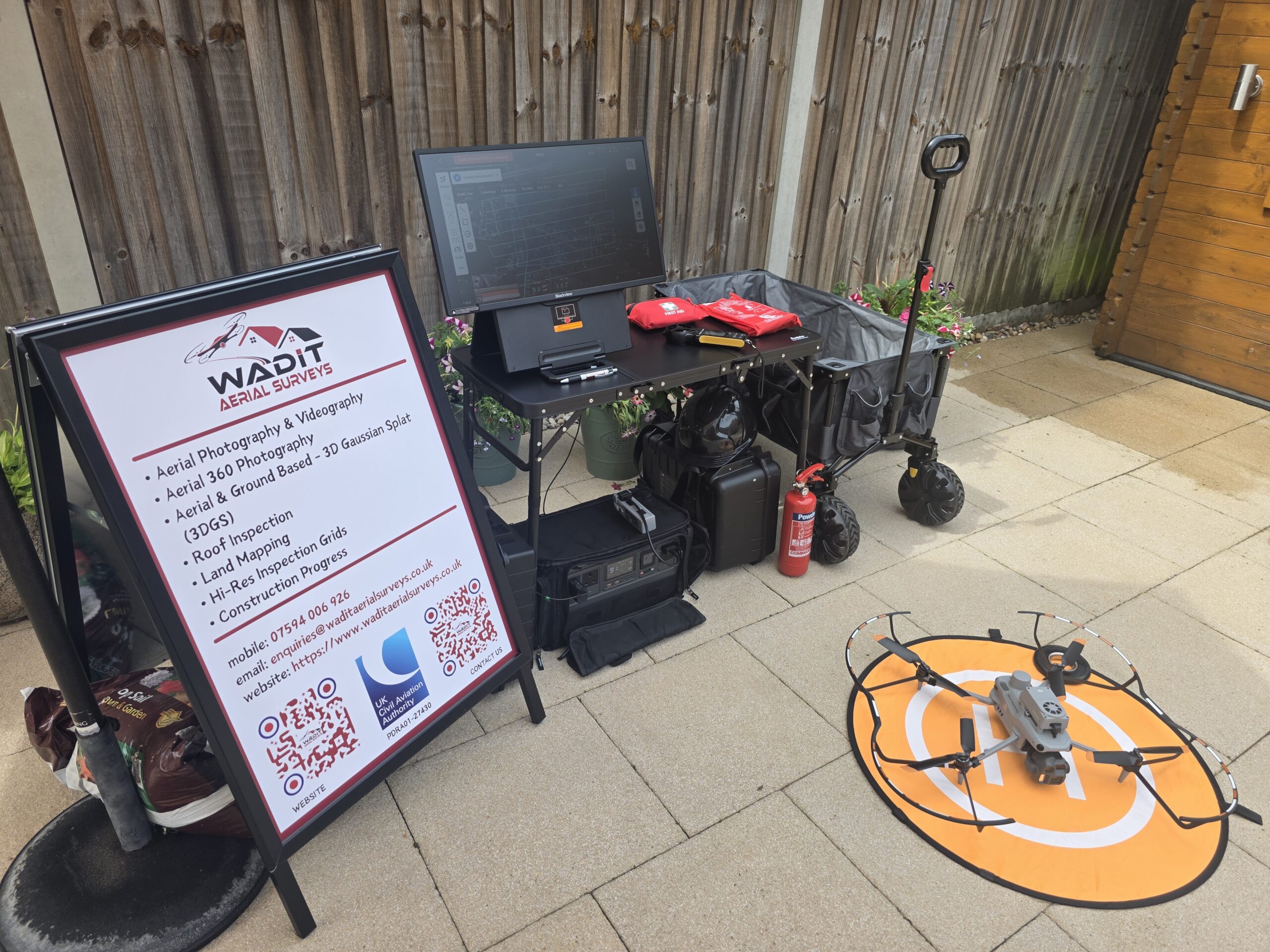 Drone setup with equipment and signage.